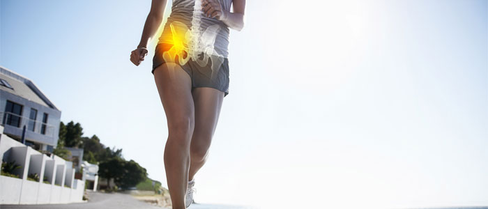 Woman with sciatica pan running with her hip highlighted